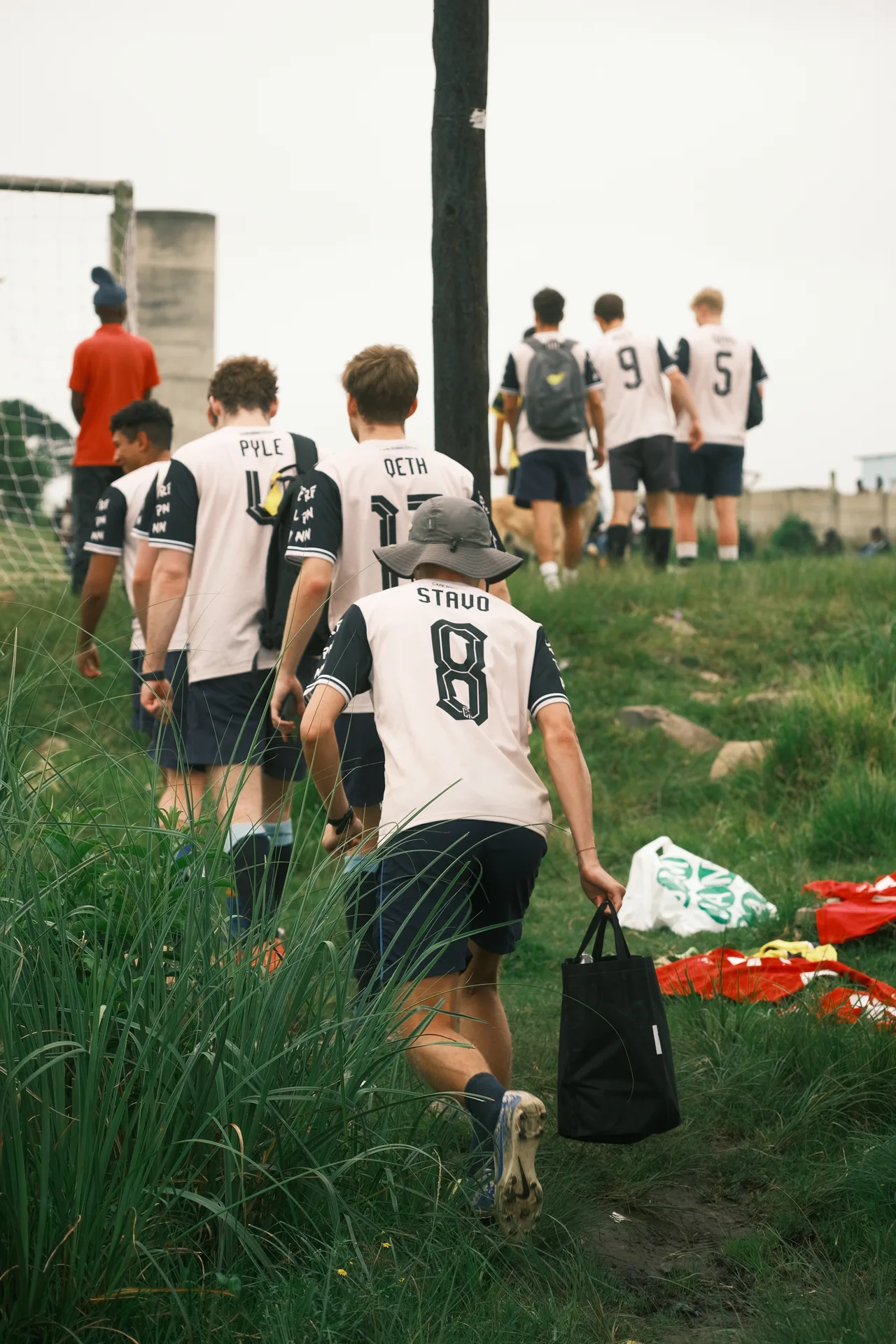 The Cape Mabenas carrying kit toward the Morgan Bay football field.